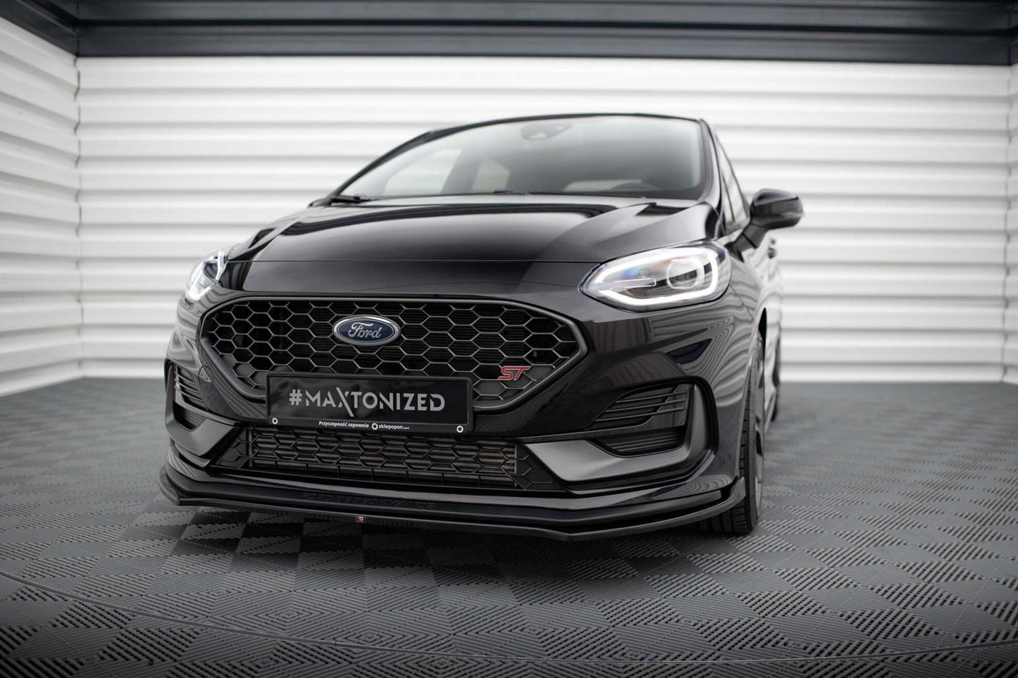 Spoiler Maxton Design versiunea 1 pentru bara faţă ST a Ford Fiesta (după 2021), negru lacuit