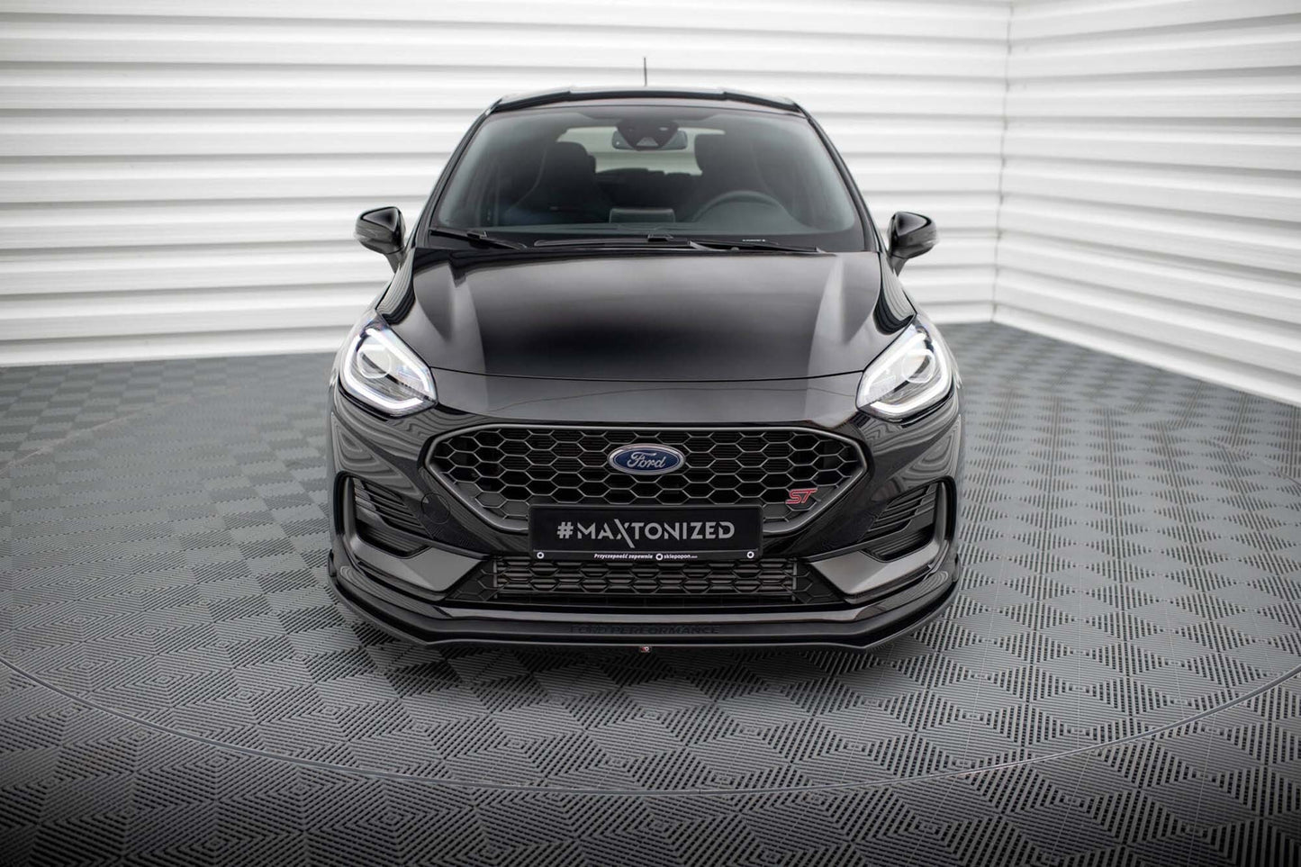 Spoiler Maxton Design versiunea 1 pentru bara faţă ST a Ford Fiesta (după 2021), negru lacuit