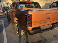 Set stopuri tuning LED pentru Ford Ranger (2011-2018), cu semnalizator dinamic, baza negru-fum, stanga si dreapta