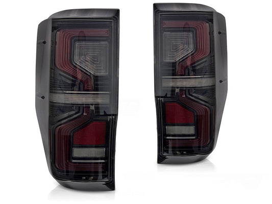 Set stopuri tuning LED pentru Ford Ranger (2011-2018), cu semnalizator dinamic, baza negru-fum, stanga si dreapta